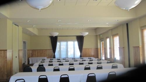 a large room with rows of tables and chairs at Rocklin Park Hotel, Trademark Collection by Wyndham in Rocklin