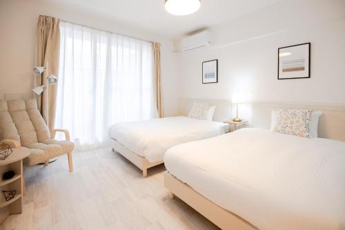 Ένα ή περισσότερα κρεβάτια σε δωμάτιο στο GuestHouse MIYABI