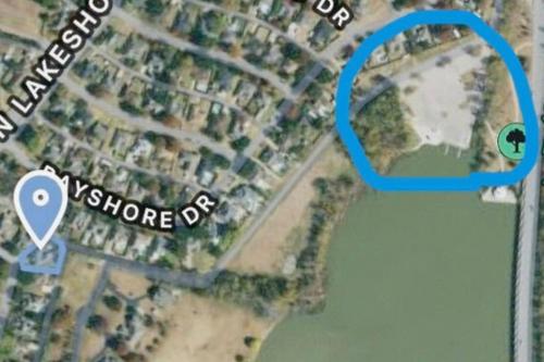 a map of a neighborhood with a blue circle at Jacuzzi Lakefront Home w/ Game room+play structure in Rockwall
