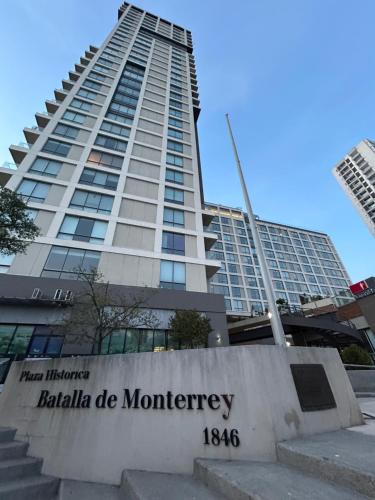 a building with a sign in front of it at Lux Loft Apt Rio Santa Lucia King size, Swim Pool, Free Parking, Gym, Kids Club in Monterrey