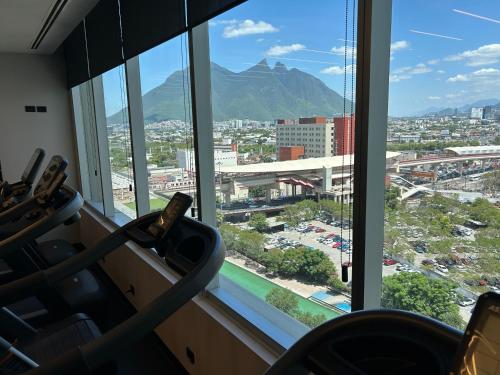 a view of a city from a window at Lux Loft Apt Rio Santa Lucia King size, Swim Pool, Free Parking, Gym, Kids Club in Monterrey
