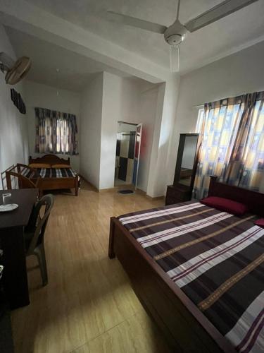 a bedroom with a large bed in a room at Aluvihare Residence in Matale