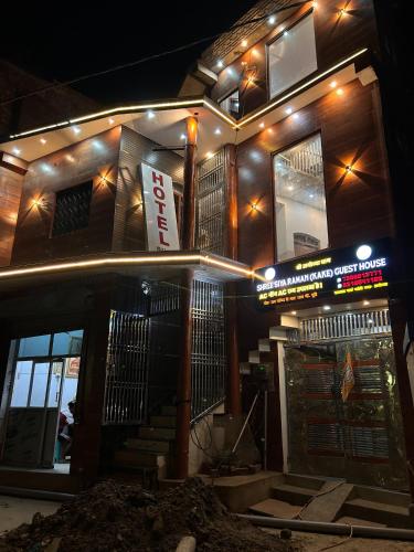 a building with a sign on it at night at Hotel S!ya Ram Ayodhya Near Ram Janam Bhoomi & Temple - fully Air Conditioned hotel at Prime Location - Parking-Wi-Fi -Lift Facilities - Best Hotel In Ayodhya in Ayodhya
