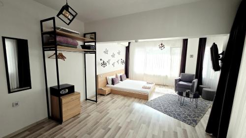 a room with a bed and a couch and a chair at Social House Istanbul in Istanbul