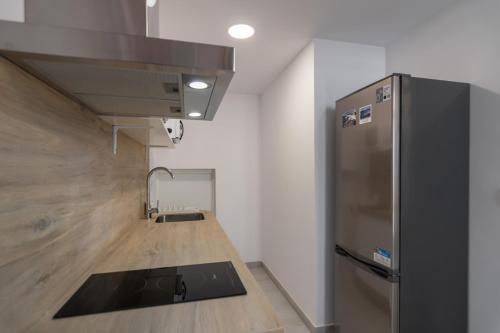 Η κουζίνα ή μικρή κουζίνα στο Apartamentos Luxury Cristina