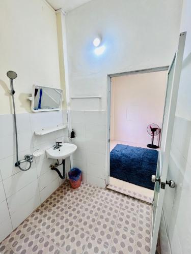 a small bathroom with a sink and a toilet at Sunlit Homestay Sapa in Sapa