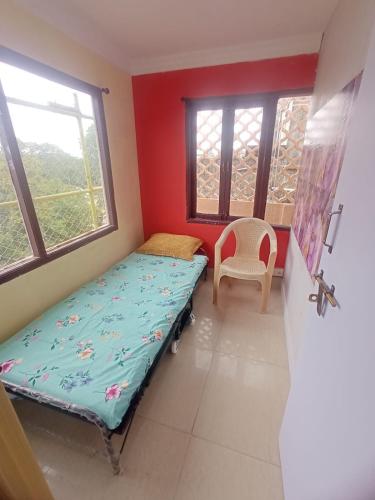 a small room with a bed and a window at WISHTREE CORPORATE MENS DORMITORY FOR TECHIES AND Trainees in Chennai
