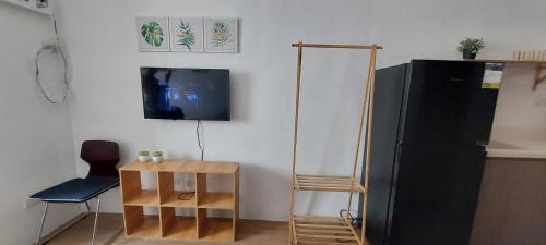 TV a/nebo společenská místnost v ubytování Eden's Sweet Escape
