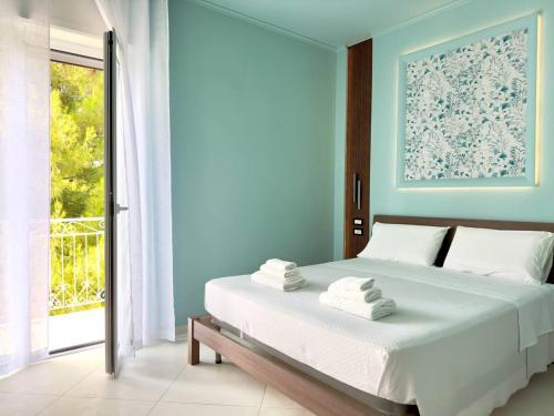 Postel nebo postele na pokoji v ubytování B&B Riviera Azzurra