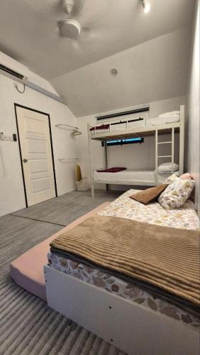a bedroom with a large bed in a room at Villa Aisya in Kampung Padang Masirat