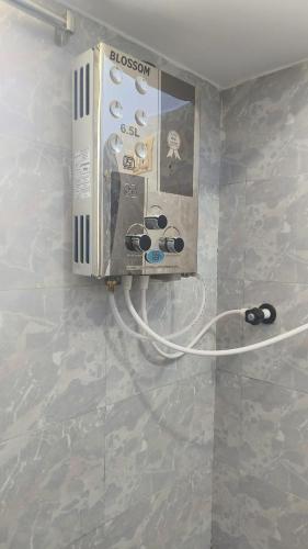 a close up of a video game system on a wall at Shivneri Homestay in Hampi