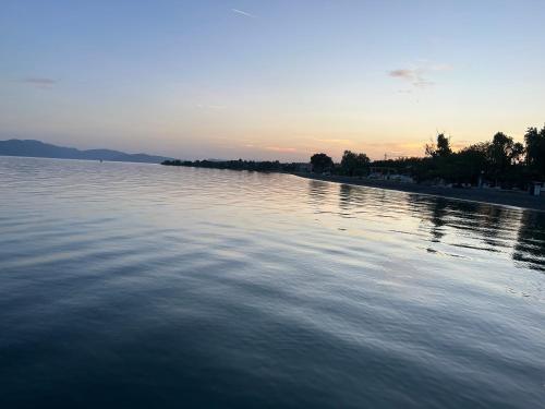 a view of a large body of water at sunset at The mint in Politiká