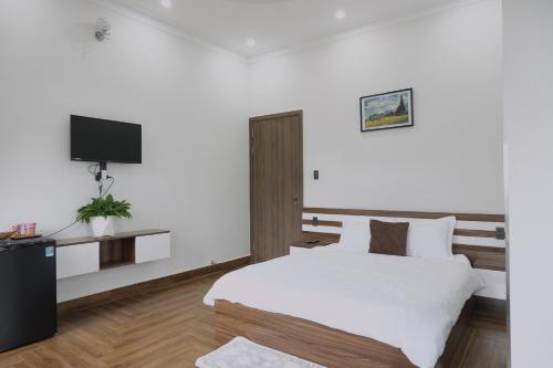 Ein Bett oder Betten in einem Zimmer der Unterkunft I'm Home in Dalat