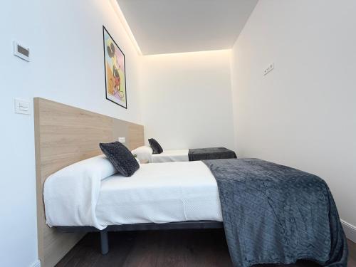 Apartamentos Mk77 León Zuloagaにあるベッド