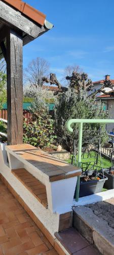 a bench sitting on top of a patio at Jolie maison modulable de 4 à 6 lits avec jardinet in Irigny