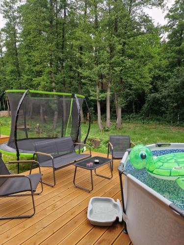 a gazebo with a table and chairs on a deck at Chill Chaty in Tarnobrzeg