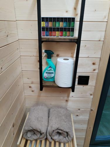a sauna with a roll of toilet paper and a shelf at A Frame Vila sa Saunom Jakuzii i toplim bazenom in Koraćica