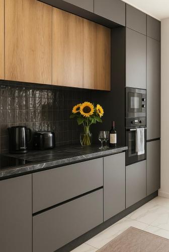 a kitchen with a vase of flowers on the counter at Luxe Escape in Malta Villa in Is-Simblija