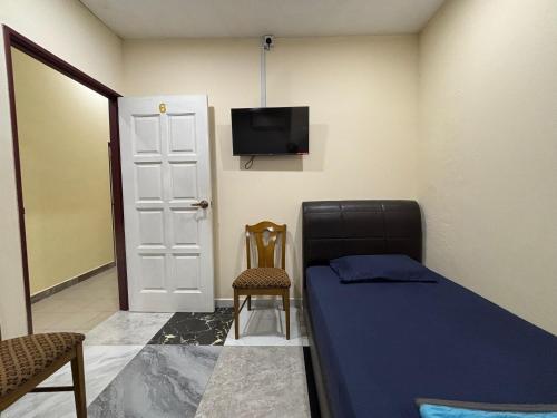 Μια τηλεόραση ή/και κέντρο ψυχαγωγίας στο Ray Yan Guesthouse Penang