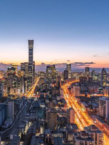 a view of a city at night at Jingfang Building Boutique Smart Hotel - near Beijing Tiananmen Square,the Forbidden City,Wangfujing Street in Beijing