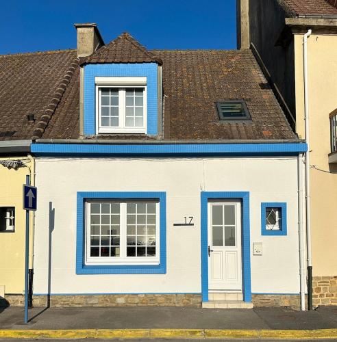 a blue and white house on a street at L'Heurt Bleue - Maison de pêcheur face mer in Le Portel