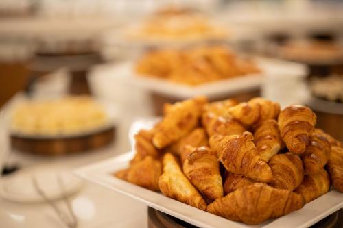 a plate of pastries sitting on a table at Grand Hotel Liberty in Riva del Garda