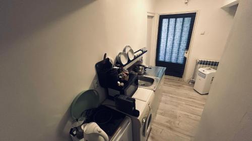 a kitchen with a stove and a sink with utensils at Sibejdo 1&2 in Varaždin