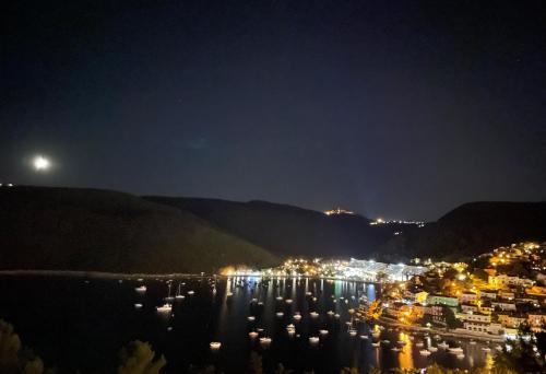 a view of a harbor at night at Istra-Hvar Luxury Penthouse in Rabac