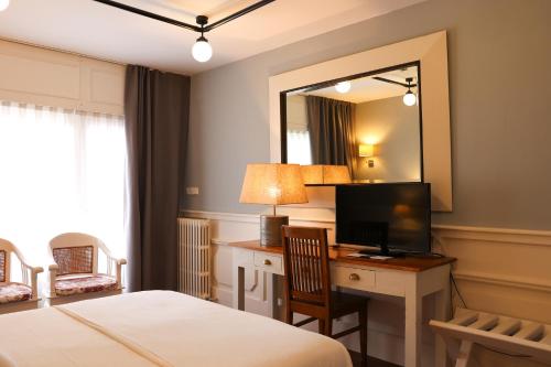 TV a/nebo společenská místnost v ubytování Hotel Vostra Llar