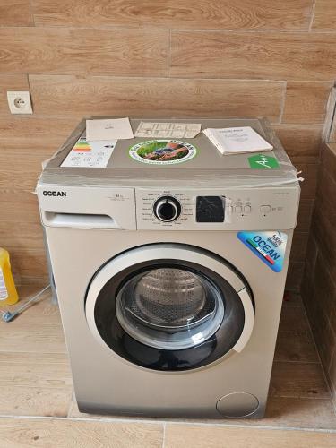 a washing machine is sitting in a room at Maison d'hôte de marque in Pointe-Noire