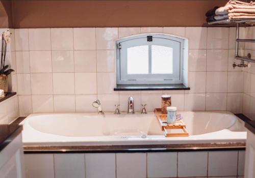 Ένα μπάνιο στο Bedandbreakfast De Vallei