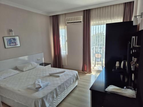 Katil atau katil-katil dalam bilik di Habesos Hotel