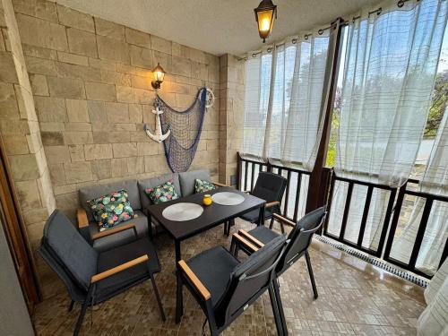 a dining room with a table and chairs at Apartment at the Seaside in Sozopol
