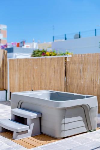 a bath tub sitting on top of a building at Casa Bom Jardim by Enjoy your stay in Olhão