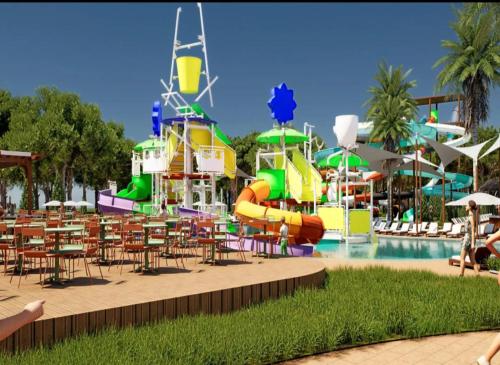 a water park with a pool and a water slide at Lovely Rooftop Apartment in Golem