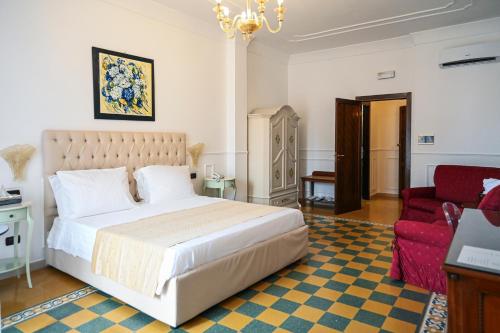 Postel nebo postele na pokoji v ubytování Hotel Palazzo Krataiis