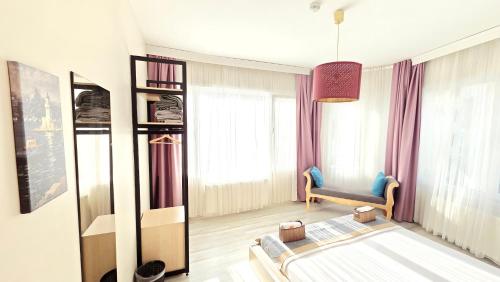 a living room with a couch and a chair in a room at Social House Istanbul in Istanbul