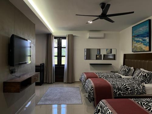 Μια τηλεόραση ή/και κέντρο ψυχαγωγίας στο Nalayan Villa Kuala Besut