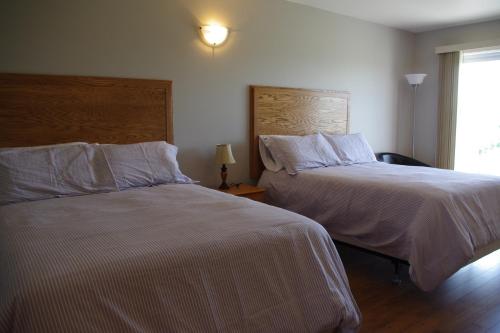 Ένα ή περισσότερα κρεβάτια σε δωμάτιο στο Motel des Mariniers