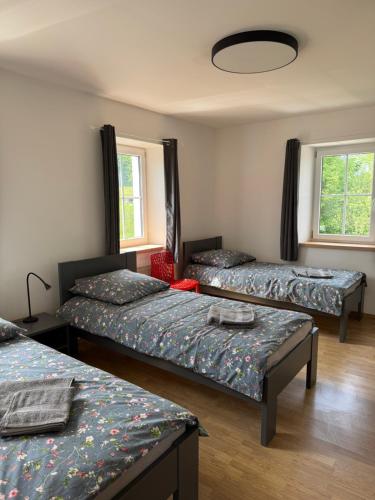 Postel nebo postele na pokoji v ubytování Apartmány Růžová