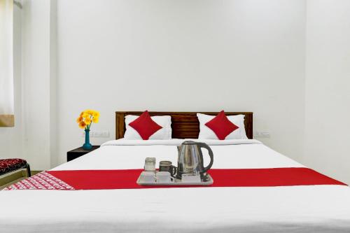 Postel nebo postele na pokoji v ubytování Hotel O S D Palace