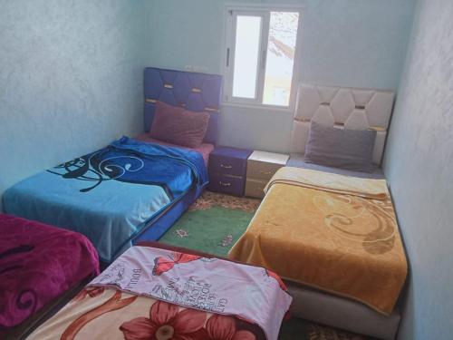 Ein Bett oder Betten in einem Zimmer der Unterkunft Gîte Ayour Atlas Tachddirt