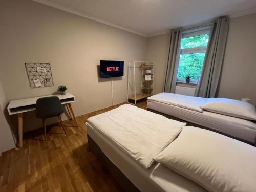 Postel nebo postele na pokoji v ubytování Ruhrperle Apartment 3 Essen