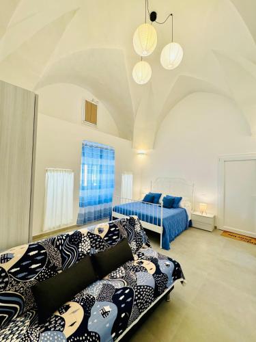 a bedroom with two beds in a room at Simone's House in Tuglie