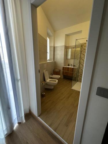 a bathroom with a toilet and a glass shower at Zoja 2 in Arona