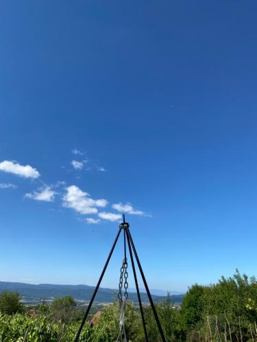 a view of the sky from a swing at Organska Farma Nebesa in Vrmdža