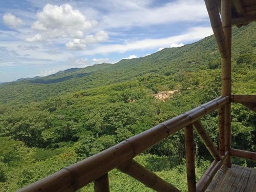 a view of a mountain from a lookout deck at El Eden Glamping cabañas Girardot in Girardot
