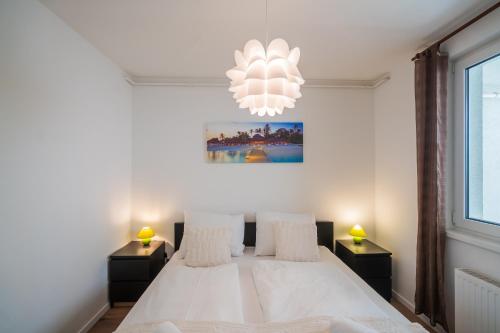 Postel nebo postele na pokoji v ubytování MyFlat Siófok Beach Apartment