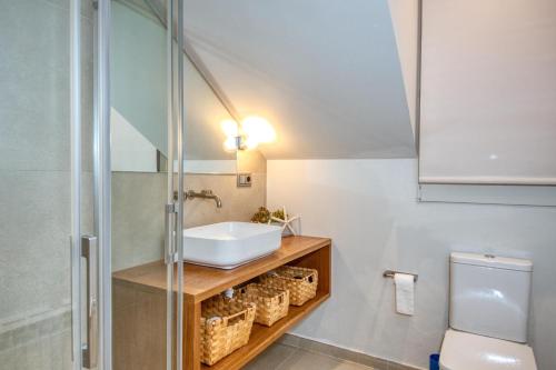 a bathroom with a sink and a shower at House in the sea in Calella de Palafrugell