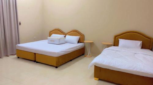 Postel nebo postele na pokoji v ubytování رهف الجنوب